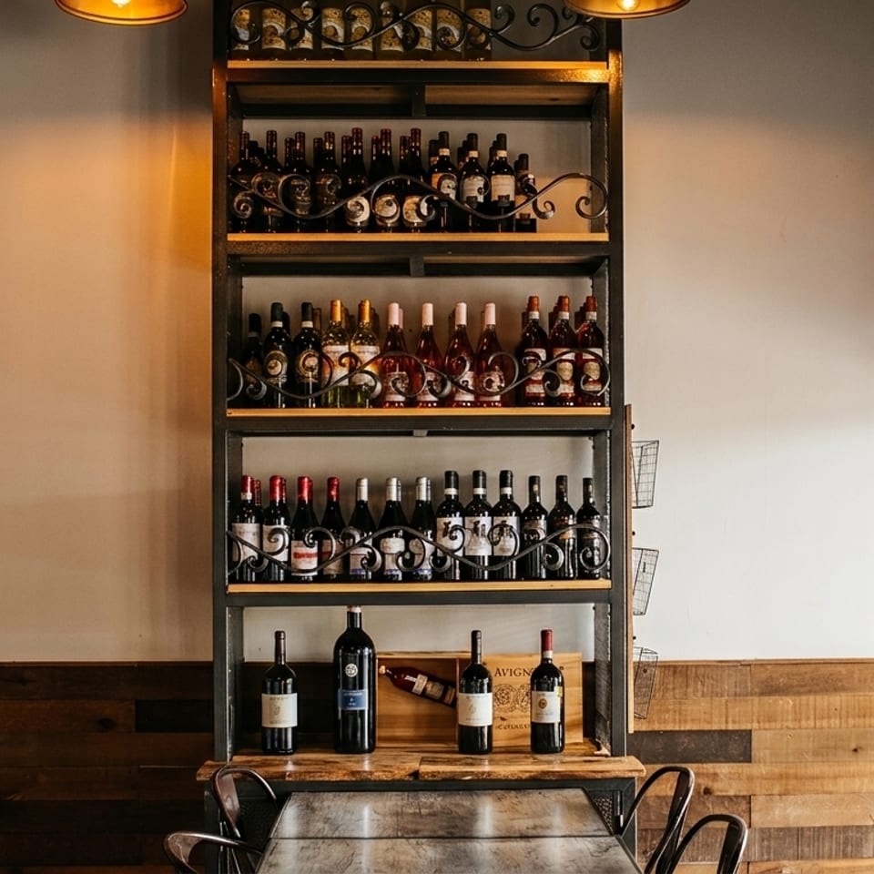 Tall metal wine rack filled with various bottles of red and white wine in a restaurant.